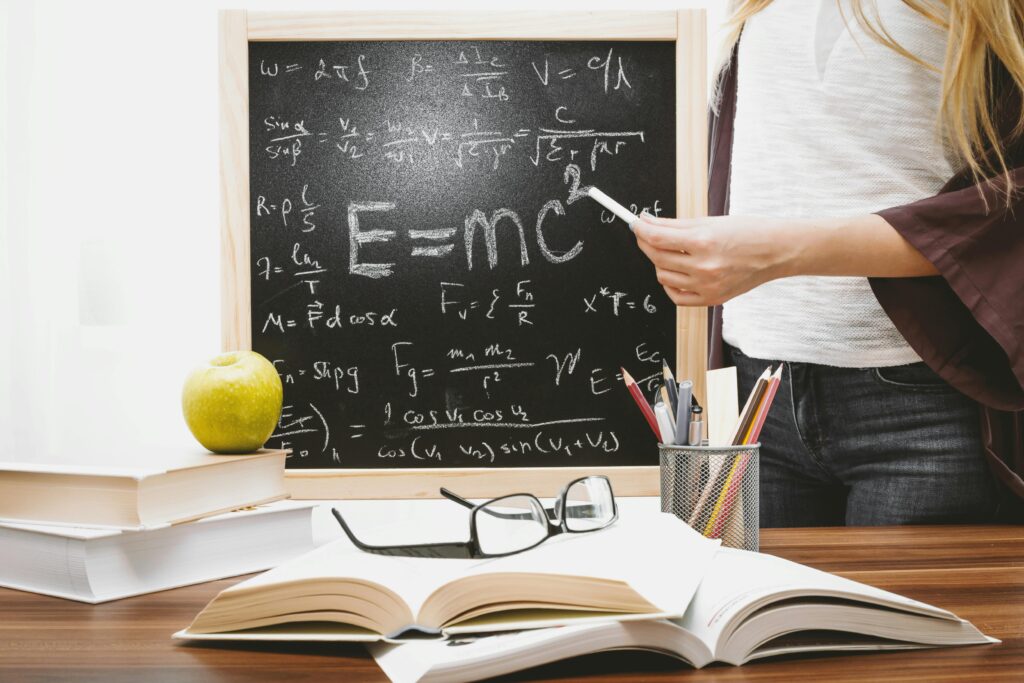 Woman Illustrating Albert Einstein Formula